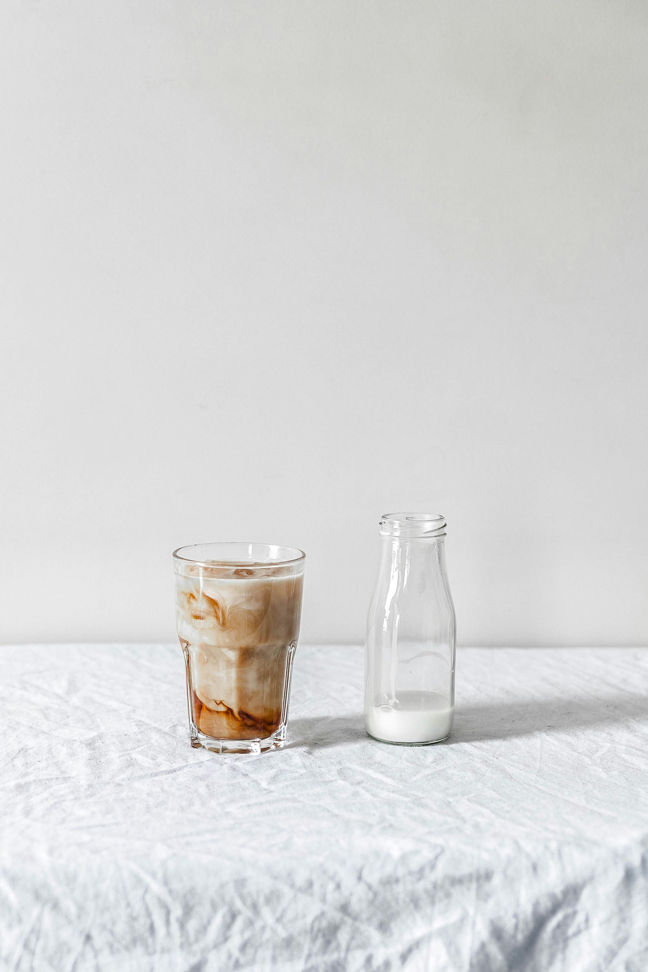 Download White Beverage Filled Clear Glass Bottle Beside Brown Liquid Filled Clear Pint Glass Photo Free Beverage Image On Unsplash Yellowimages Mockups