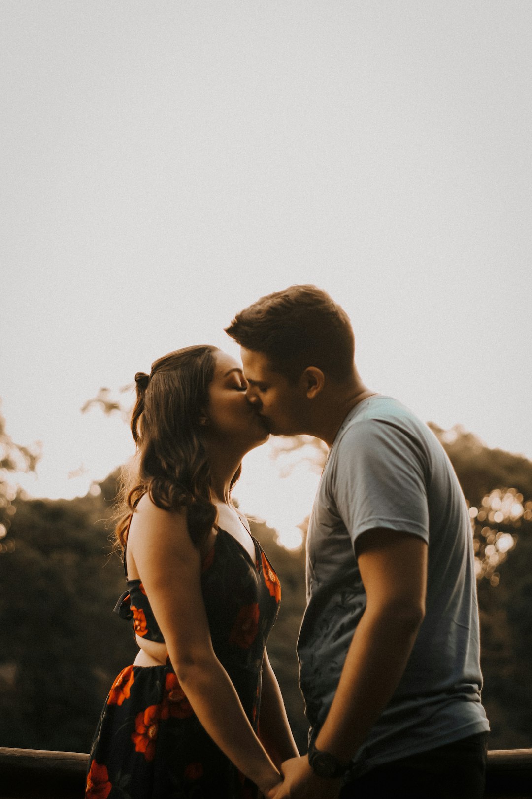 couple kissing during daytime photo