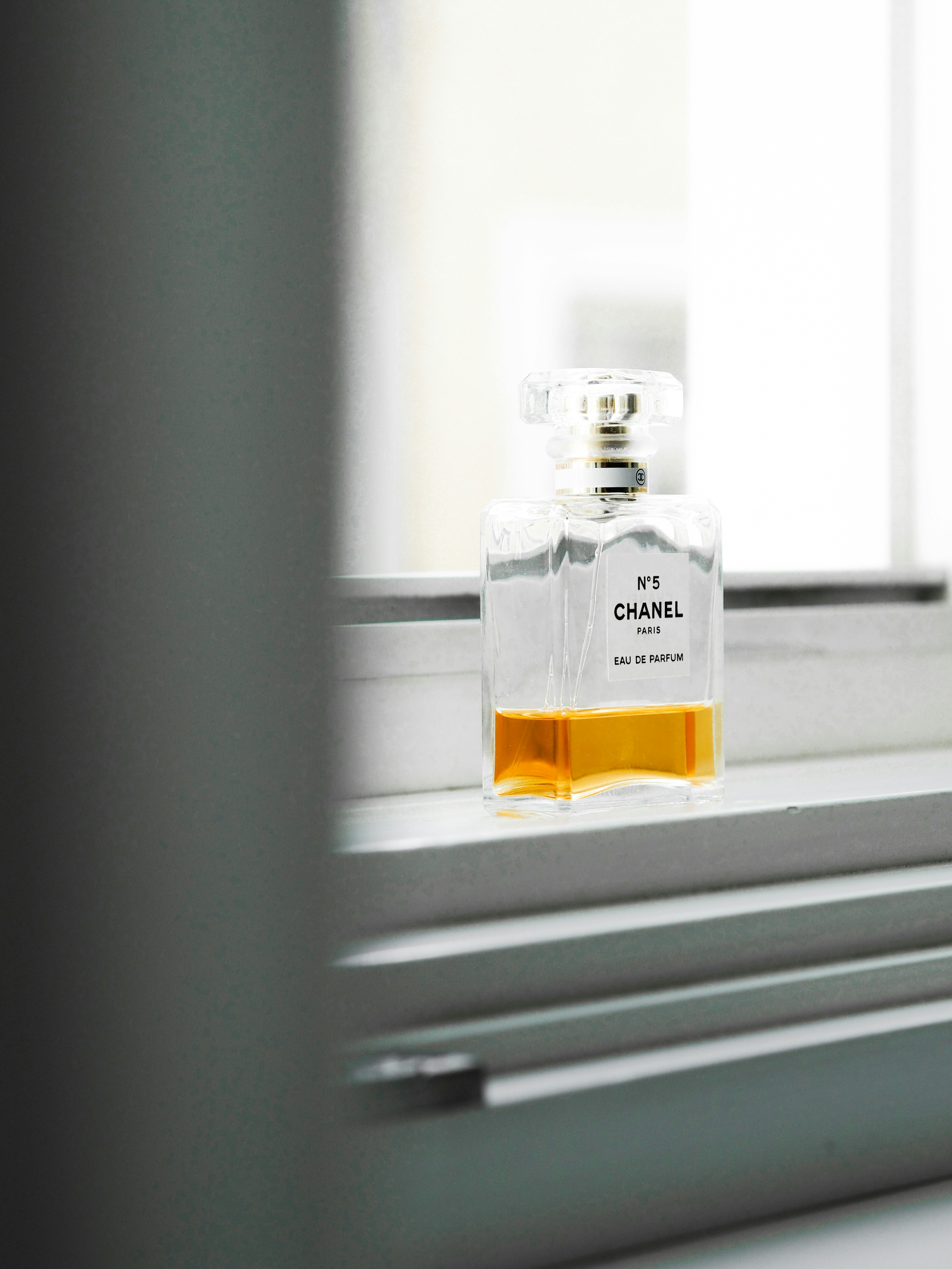 Download Clear Glass Bottle With Yellow Liquid Photo Free Perfume Image On Unsplash Yellowimages Mockups