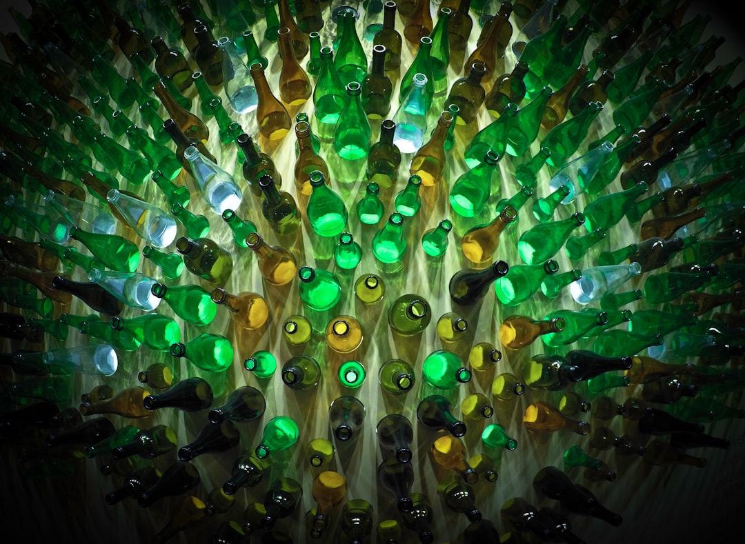 Green And Yellow Glass Bottles Photo Free Art Image On Unsplash