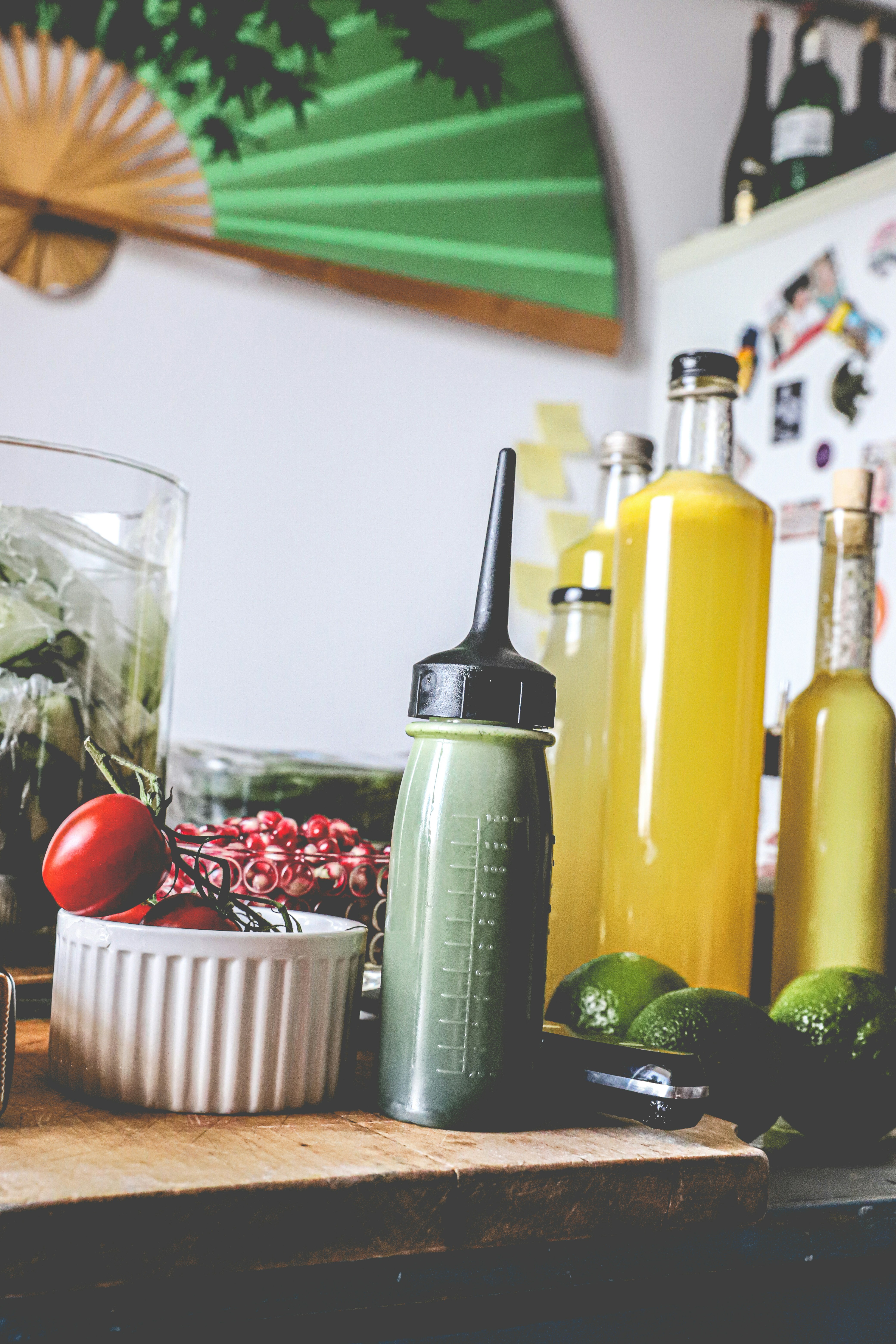 Download Green And Yellow Plastic Bottle Beside Clear Drinking Glass Photo Free Plant Image On Unsplash PSD Mockup Templates