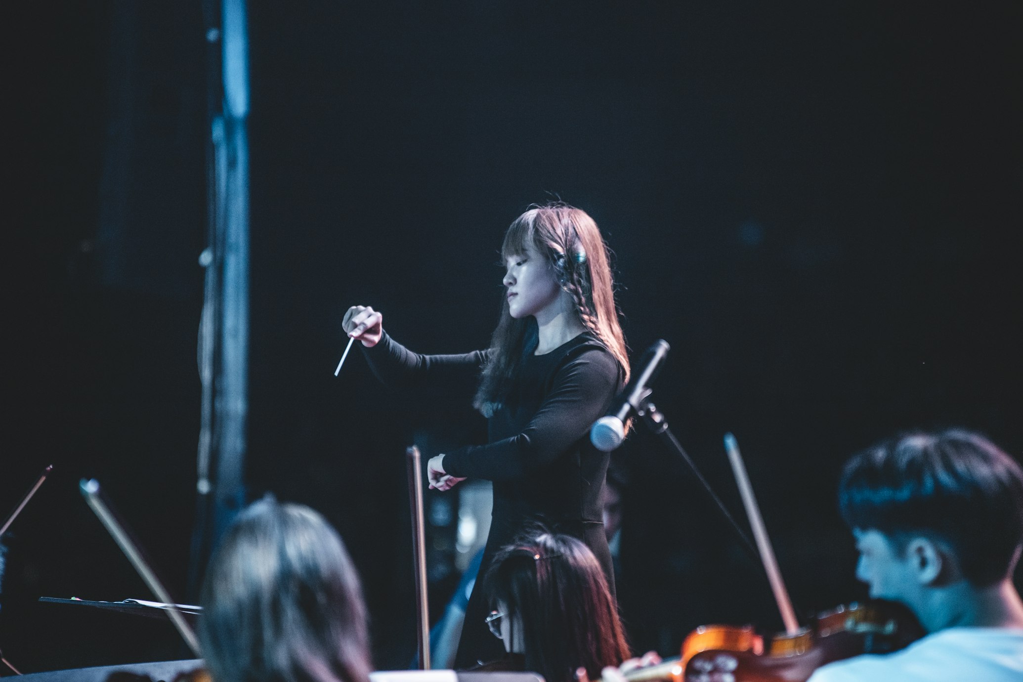 conductor orchestrating a choir