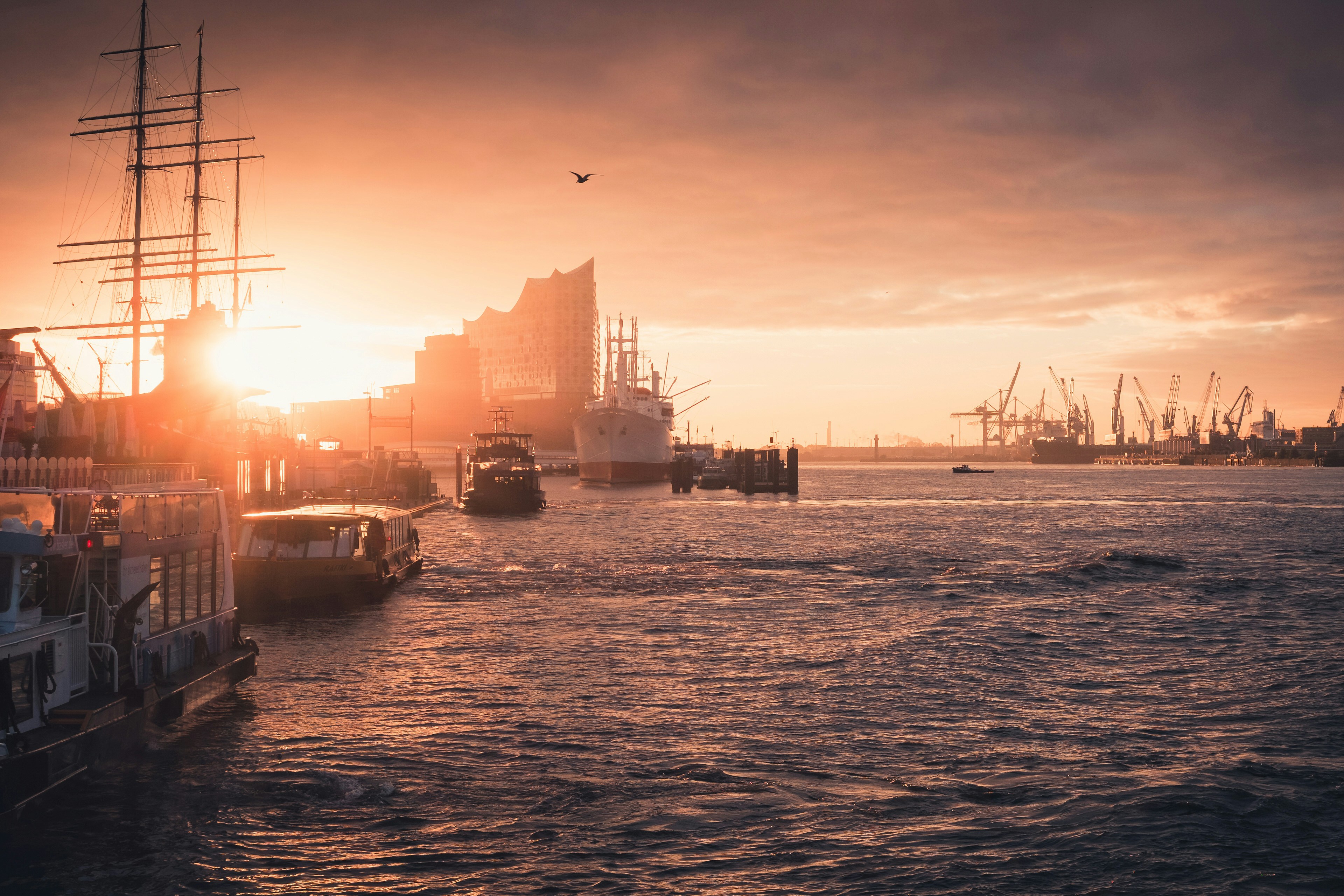 Silhouette Of Boat On Sea During Sunset Photo Free Hamburg Image On Unsplash