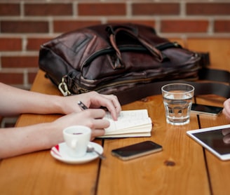 two person sitting in front of table