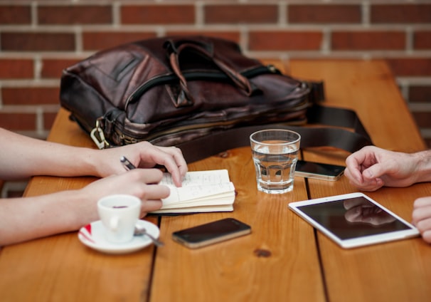 two person sitting in front of table