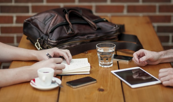 two person sitting in front of table