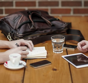 two person sitting in front of table