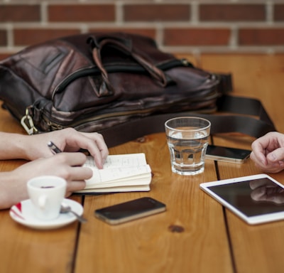 two person sitting in front of table