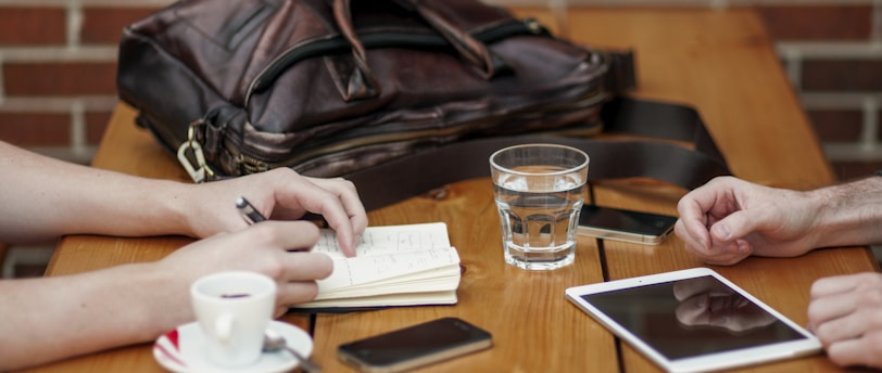 two person sitting in front of table