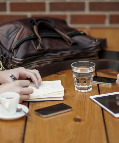 two person sitting in front of table
