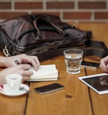 two person sitting in front of table
