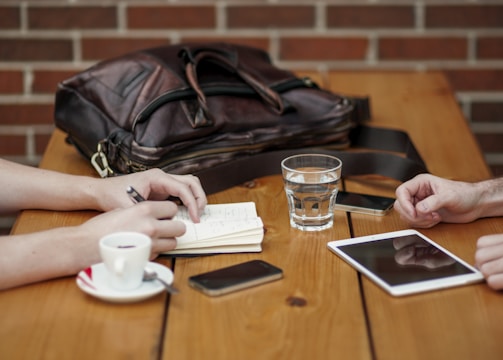 two person sitting in front of table