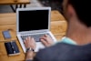 Person typing on computer
