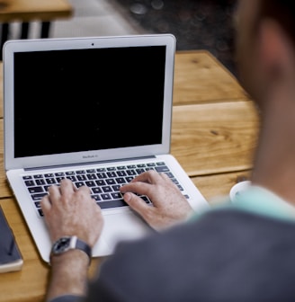 man using MacBook Air
