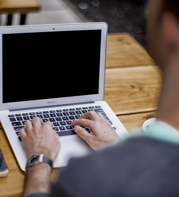 man using MacBook Air