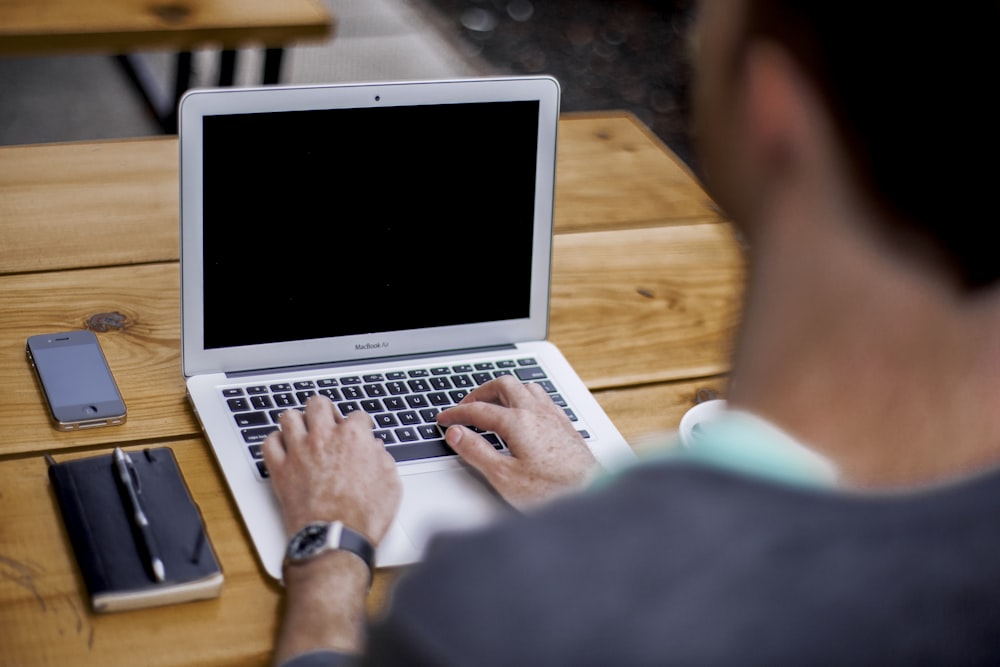 man using MacBook Air