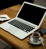 MacBook Air on brown wooden table