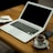 MacBook Air on brown wooden table