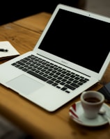 MacBook Air on brown wooden table