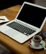 MacBook Air on brown wooden table
