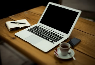 MacBook Air on brown wooden table