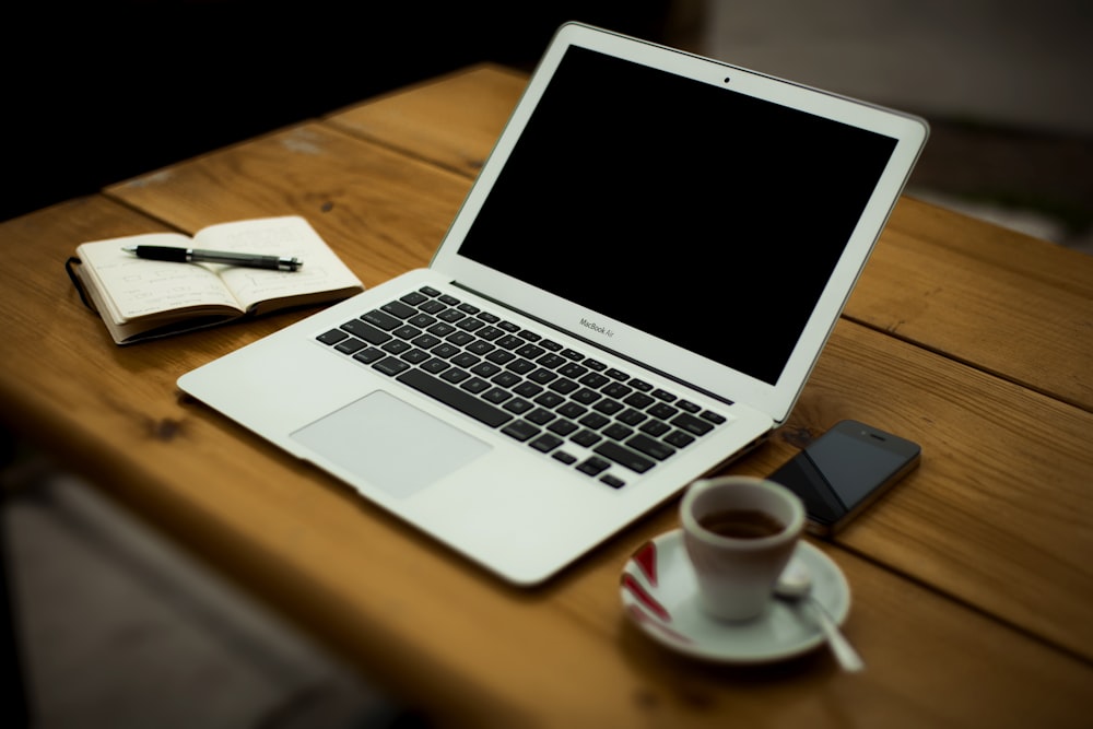 MacBook Air on brown wooden table