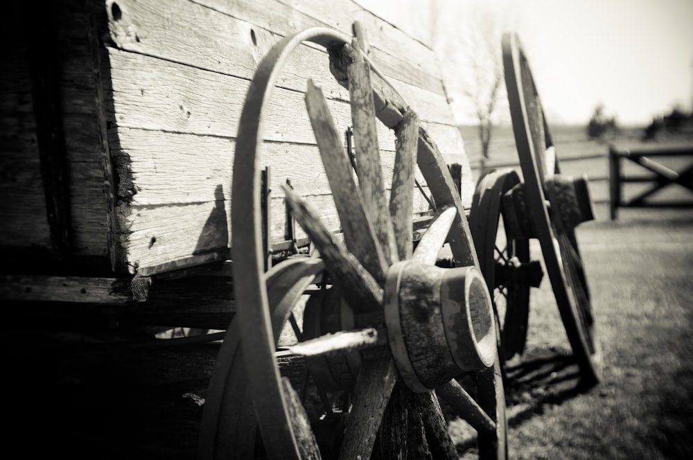 grayscale photo of wagon wheel
