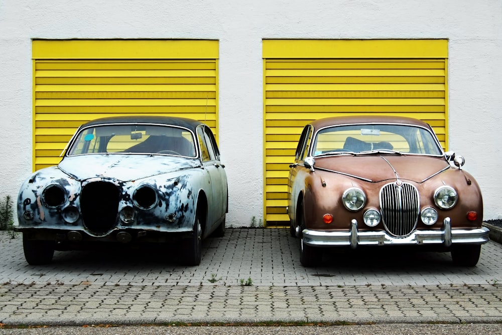 two cars in front of shutter doors