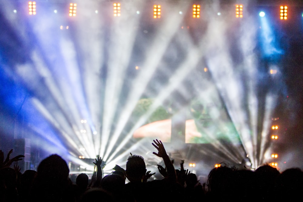 lighted stage full of people