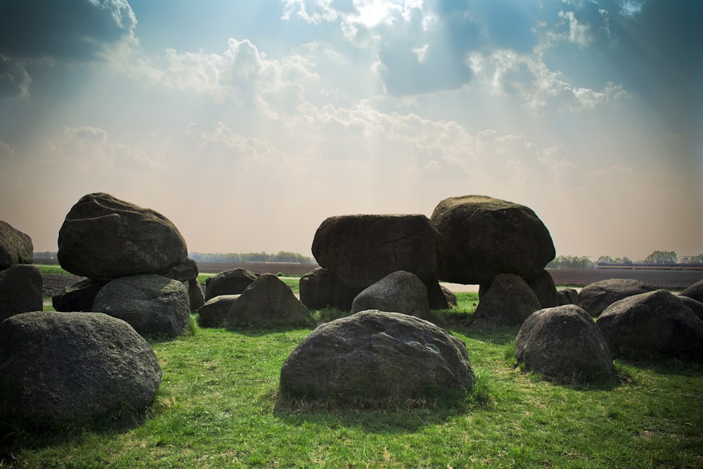 stone formation at the green grass field