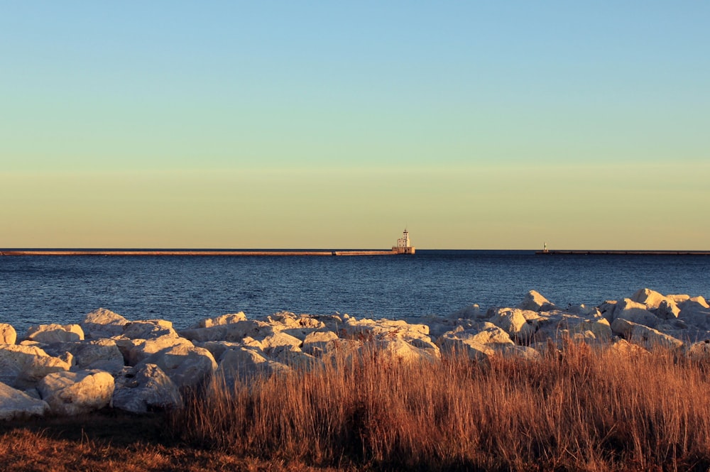 landscape photo of rocks near body of water