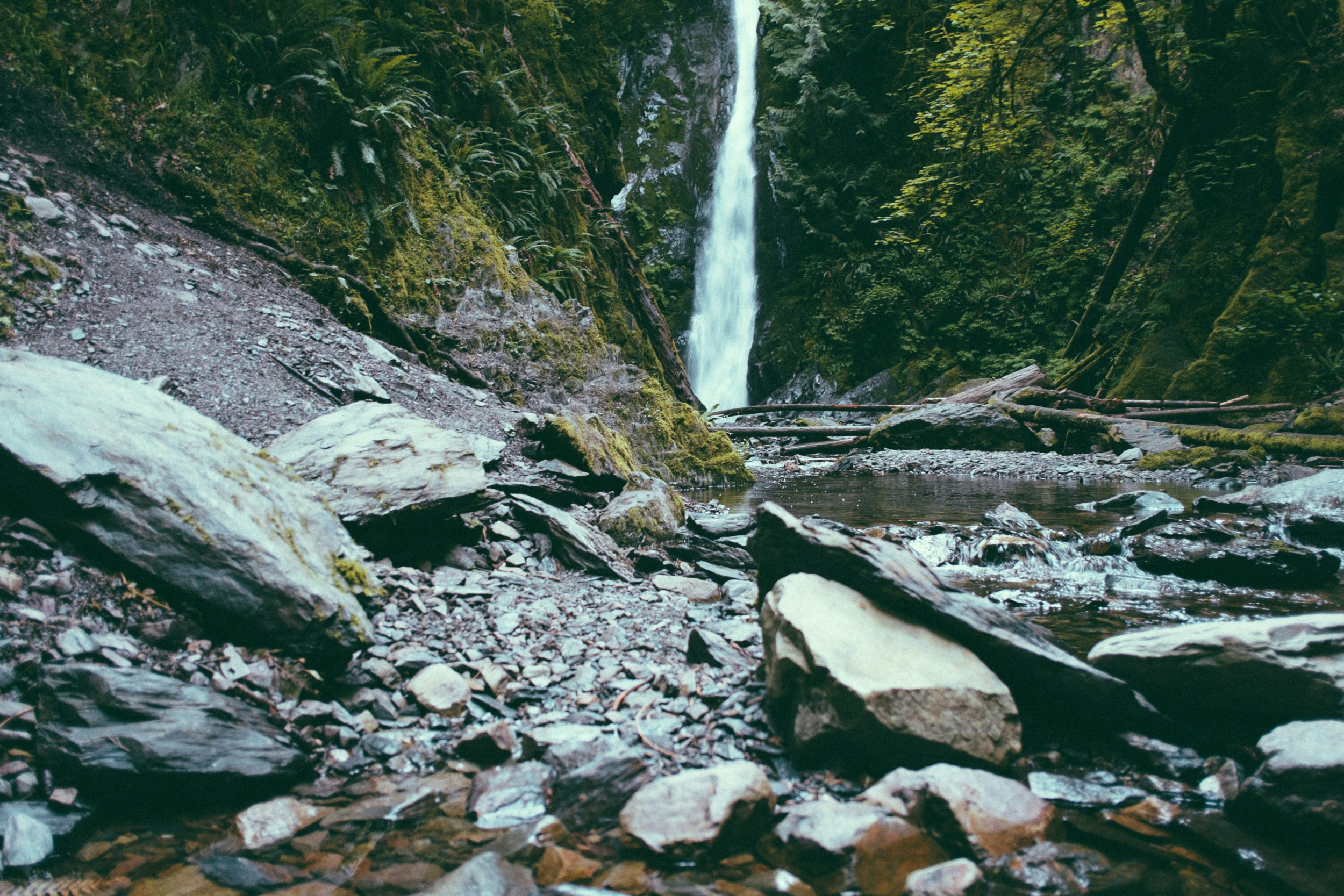 "Rocky creek with a waterfall"