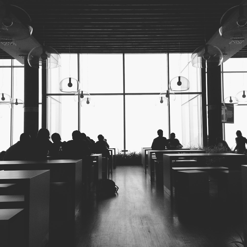 silhouette of people inside room with lights turned off