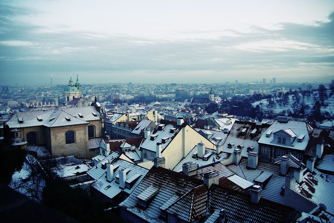 aerial photography of houses, City rooftops covered in snow in Prague.