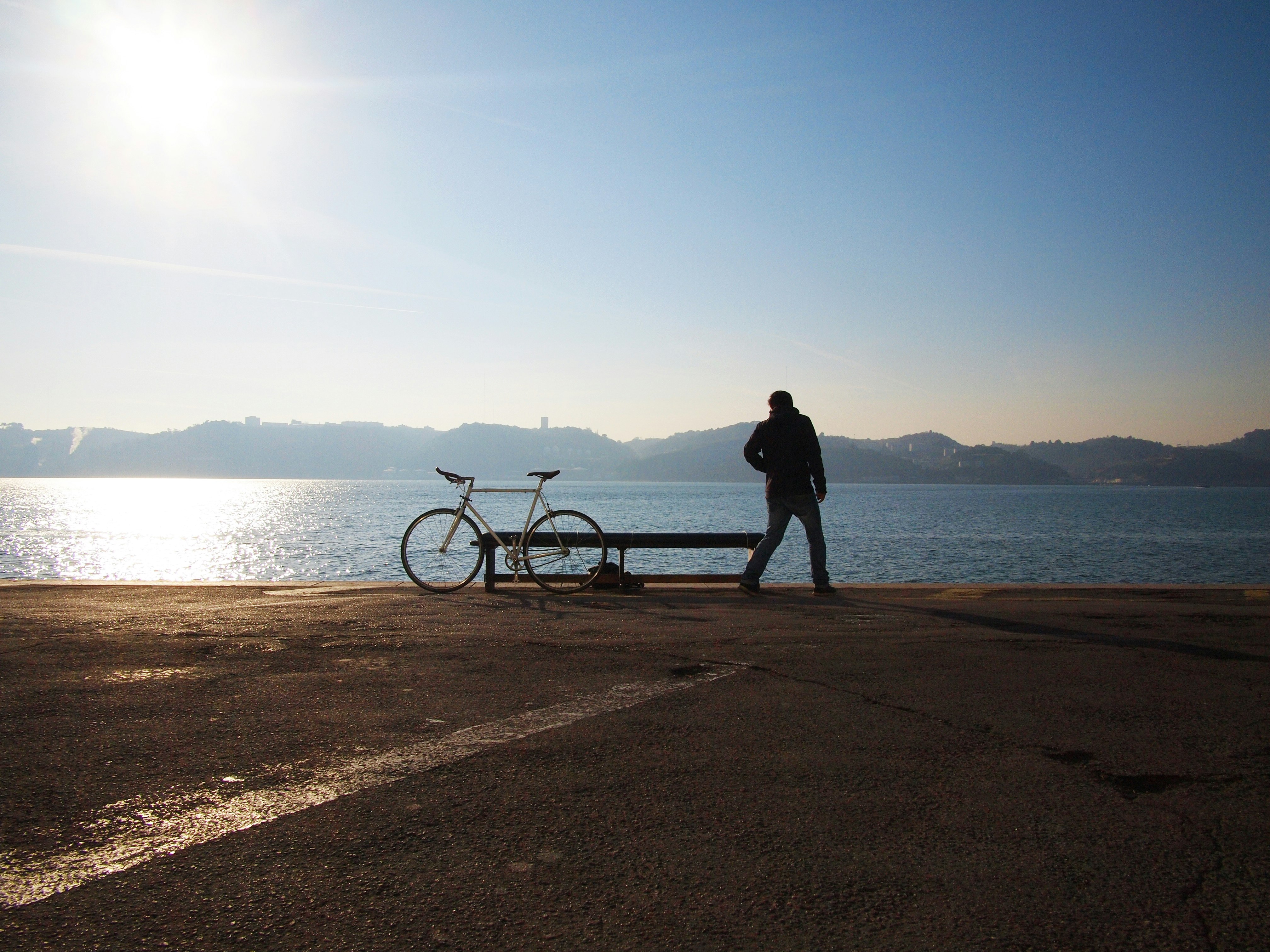 person standing beside of city bicycle