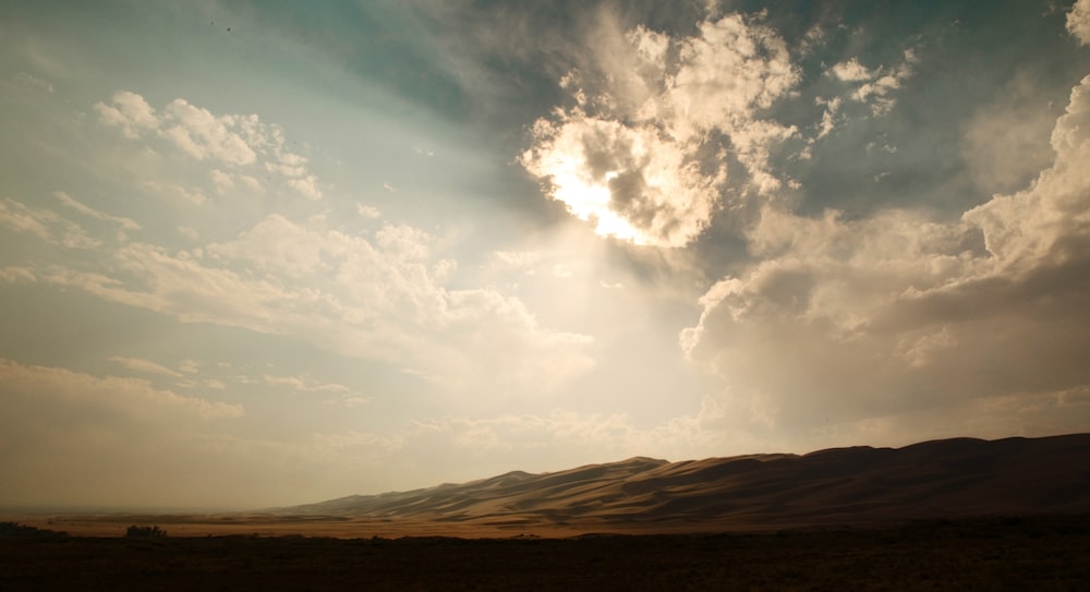 mountain during sunrays at daytime