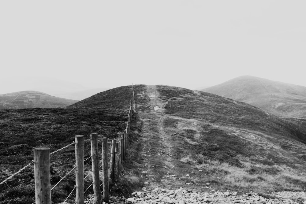 brown wooden fence on the mountain