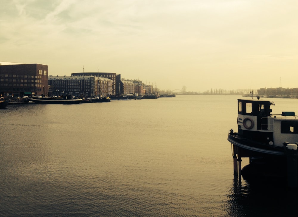 sepia photo of dock and buildings