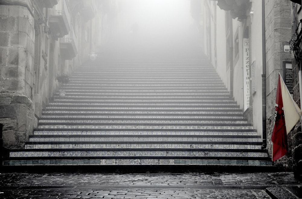 greyscale photography of concrete stairways