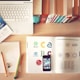 pencils and smartphone on top of books