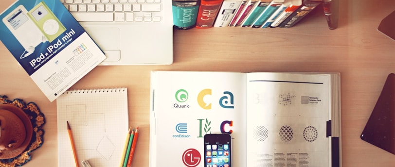 pencils and smartphone on top of books