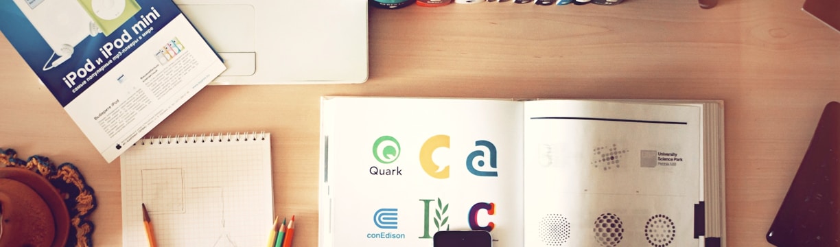 pencils and smartphone on top of books
