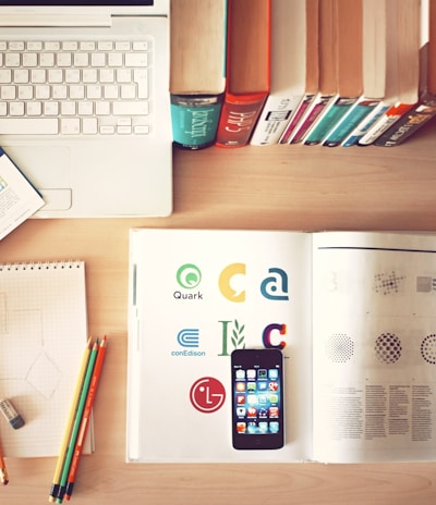 pencils and smartphone on top of books