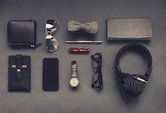 black corded headphones near eyeglasses