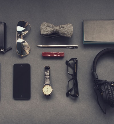 black corded headphones near eyeglasses