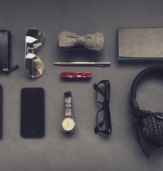 black corded headphones near eyeglasses