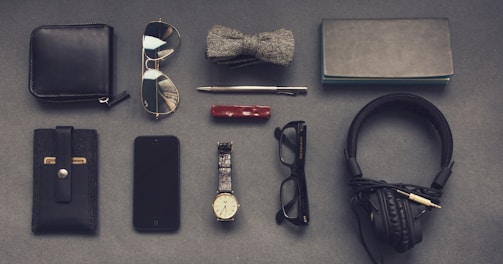 black corded headphones near eyeglasses