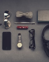 black corded headphones near eyeglasses