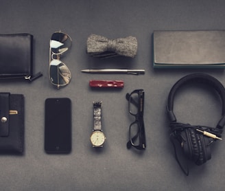 black corded headphones near eyeglasses