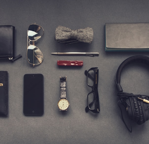 black corded headphones near eyeglasses